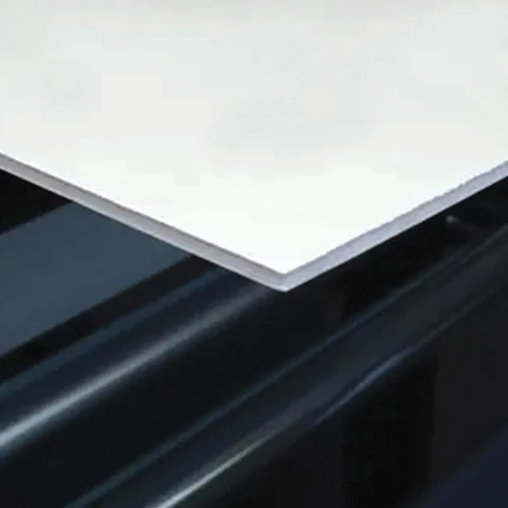 White square edge of foam board lying on black background.