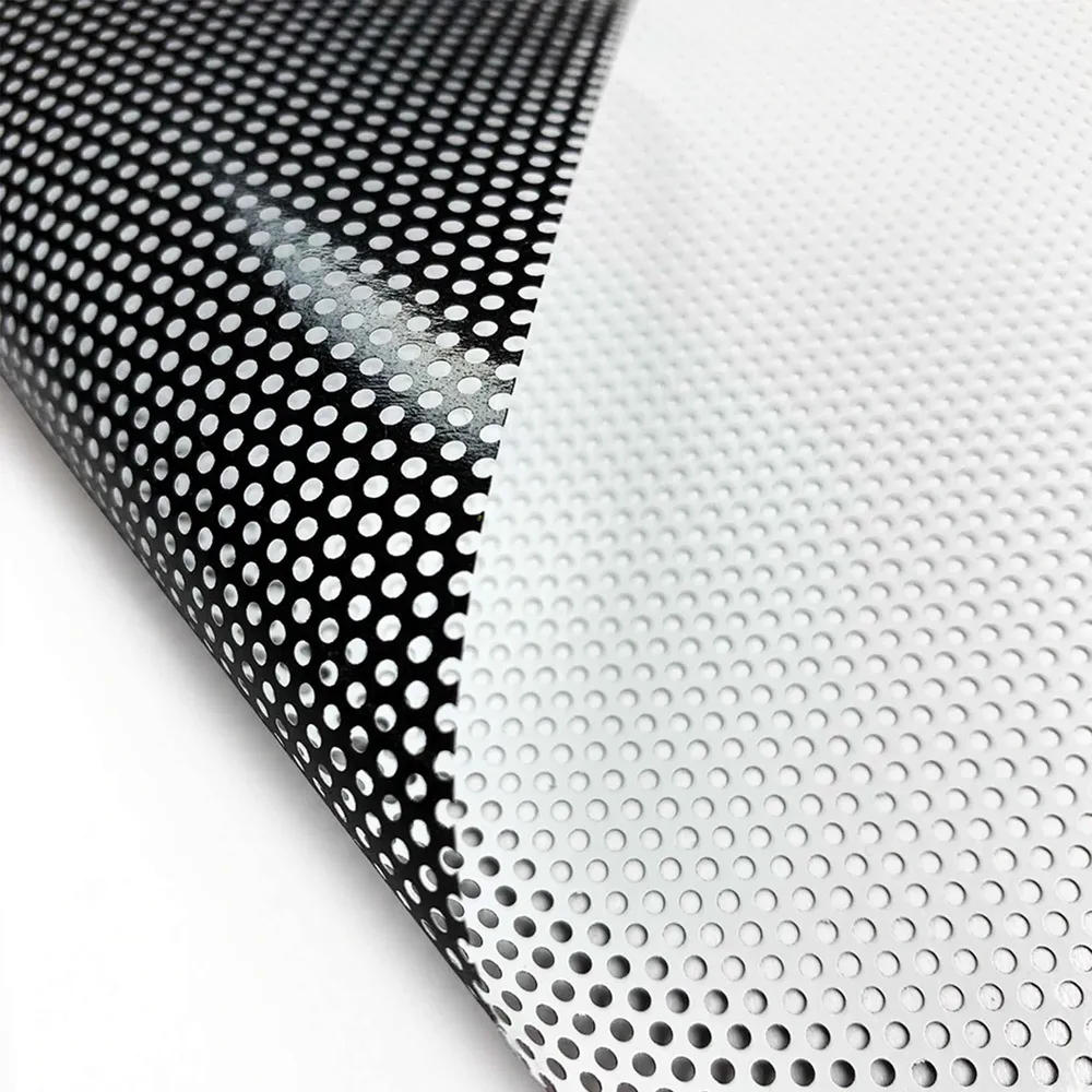 Material example of window perf showing white print side and black adhesive side.