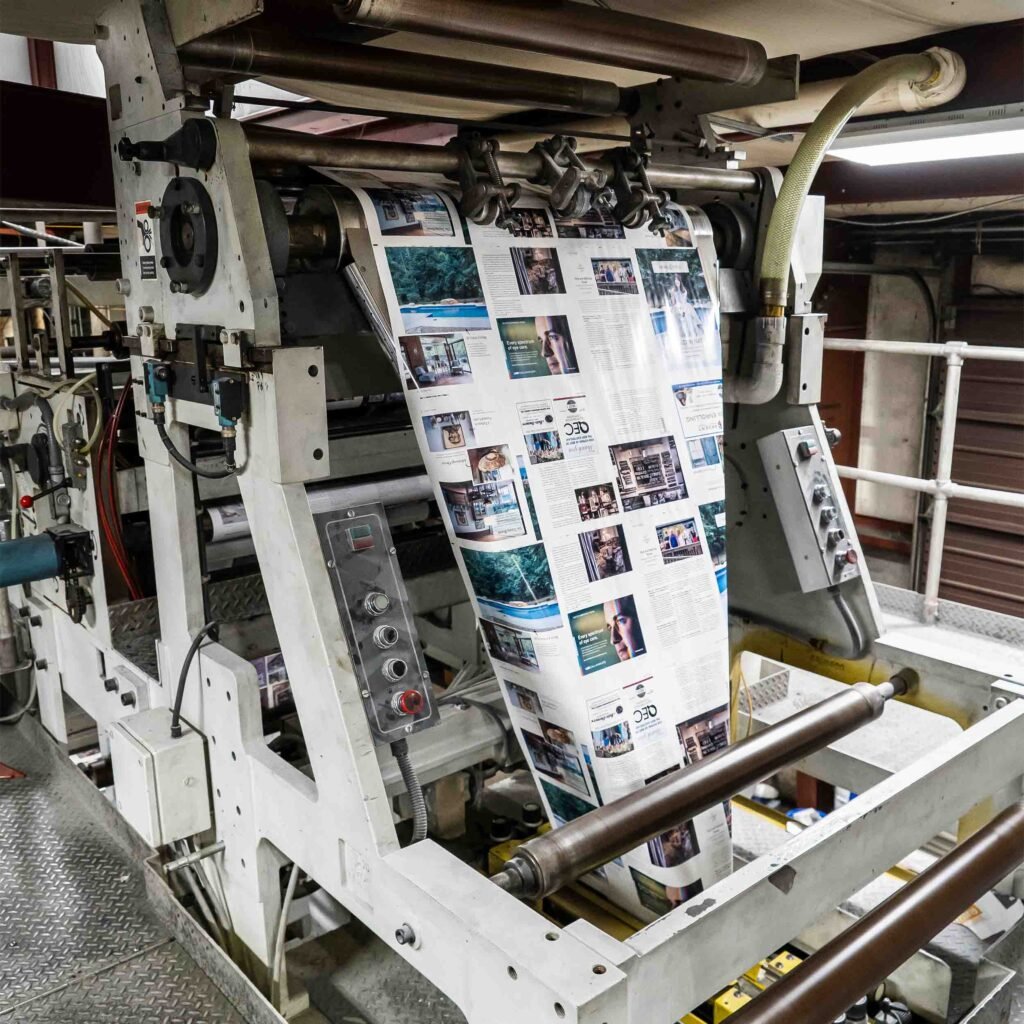 Large heat-set printing press printing multi-color pages.