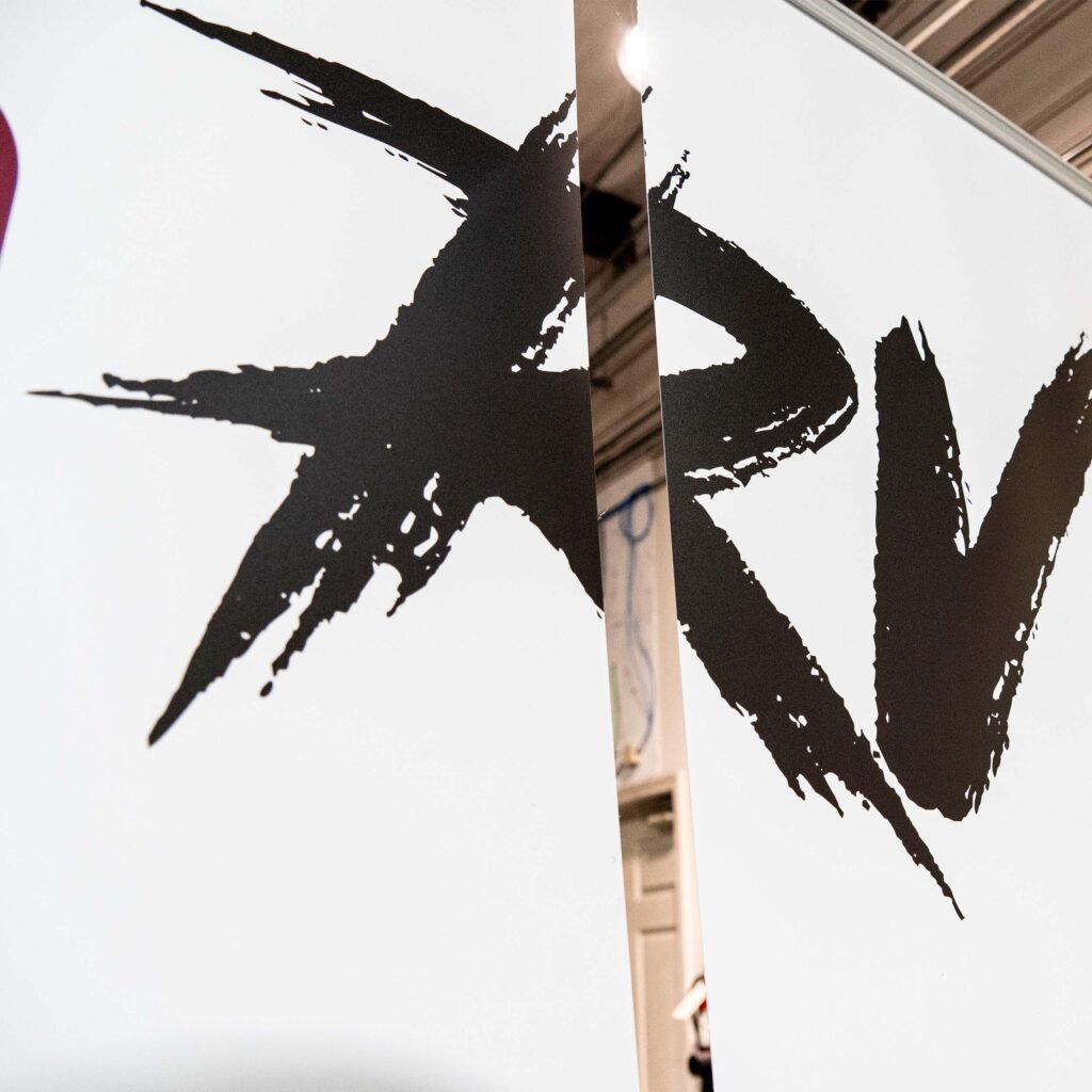 A close look at the print on the pop-up banner. Lettering spelling "RV".