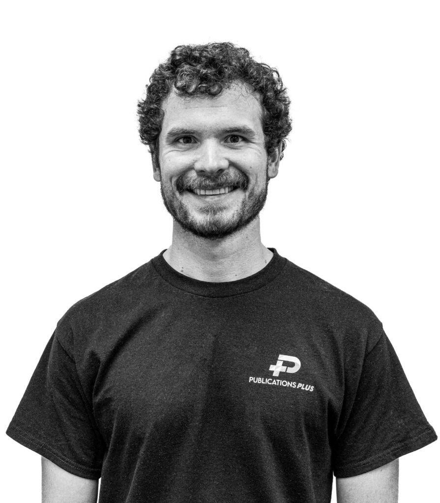 A man in front of a white background.