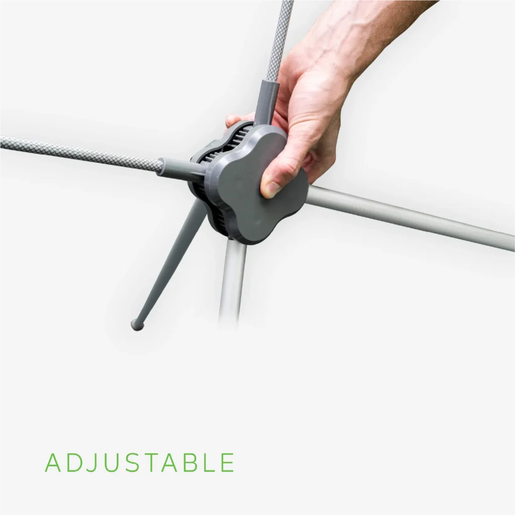 Hand adjusting x banner frame on a white background.